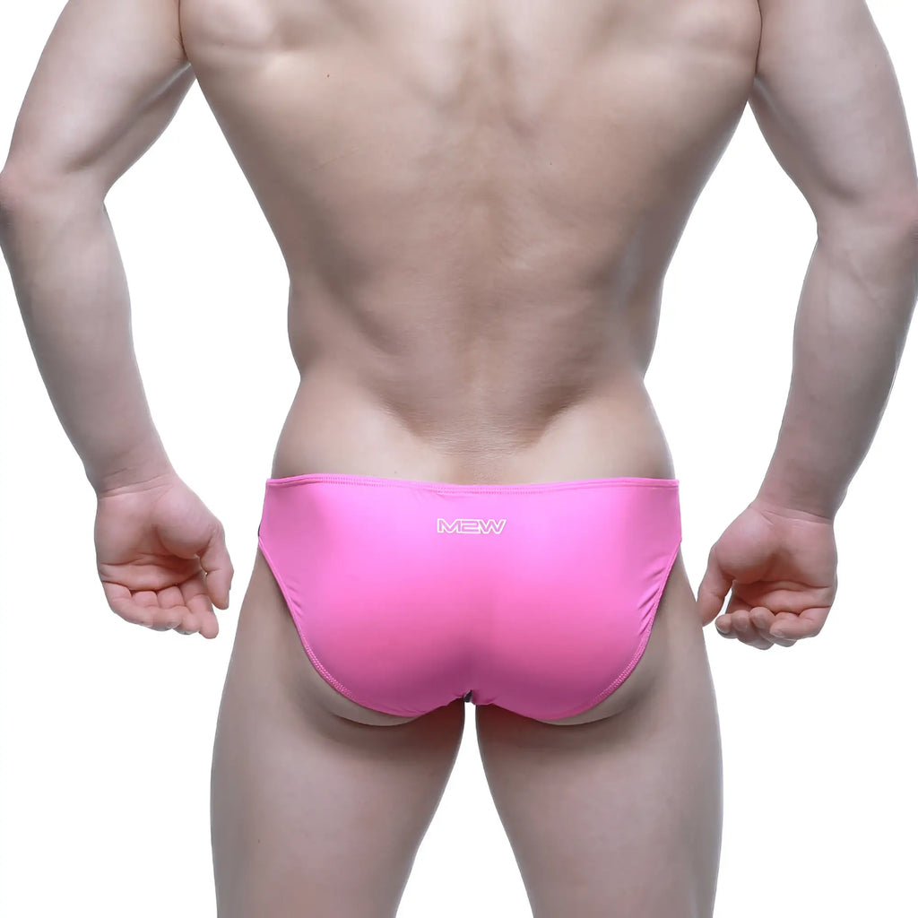Bright pink MetroMaleWear Alegria bikini swim trunks with sleek form-fitting design for stylish beachwear