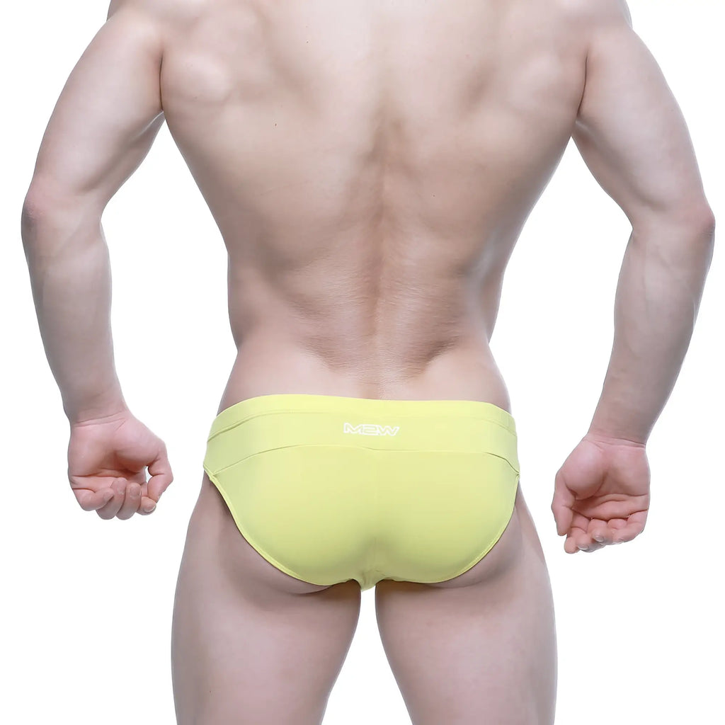 Bright yellow metro male wear aluche bikini briefs with a subtle white logo on the waistband for men