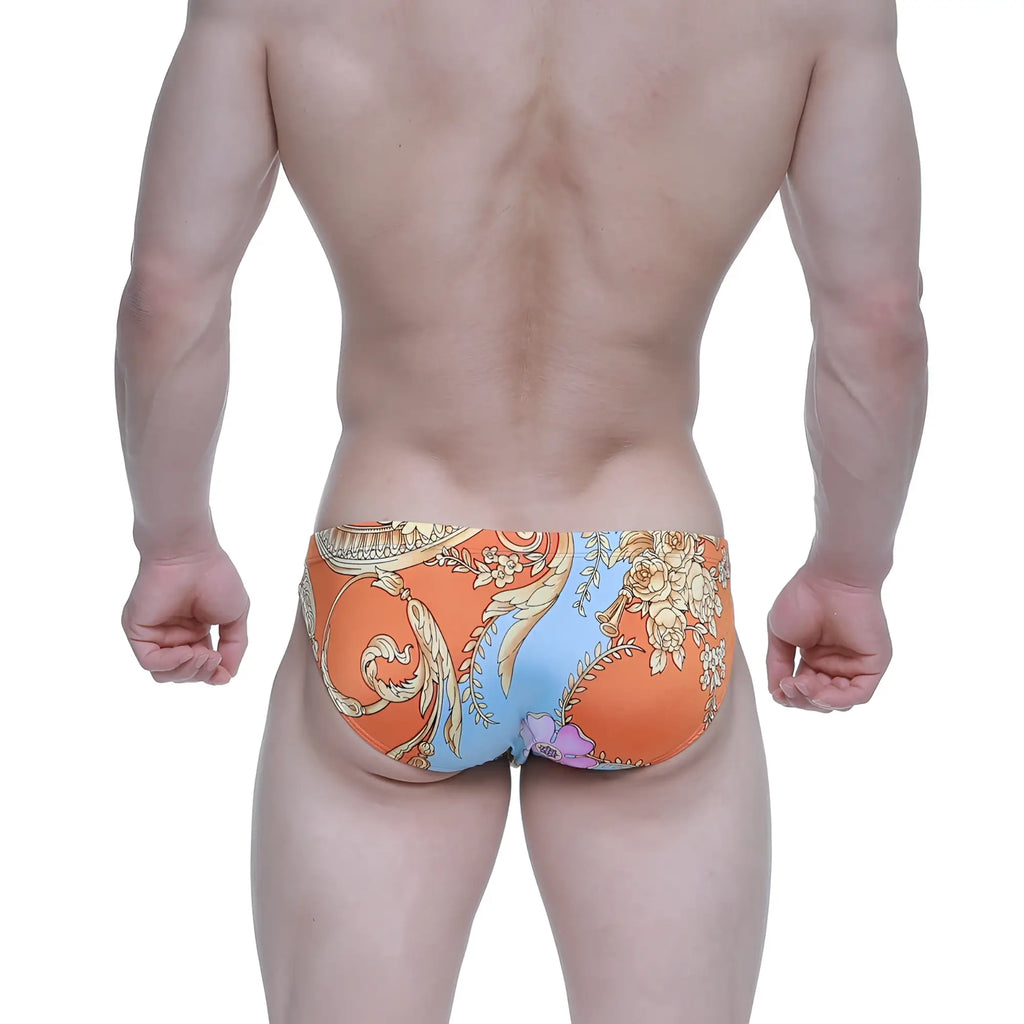 Orange and blue patterned swim trunks with ornate floral design by metroMalewear antique bikini 5103-M68