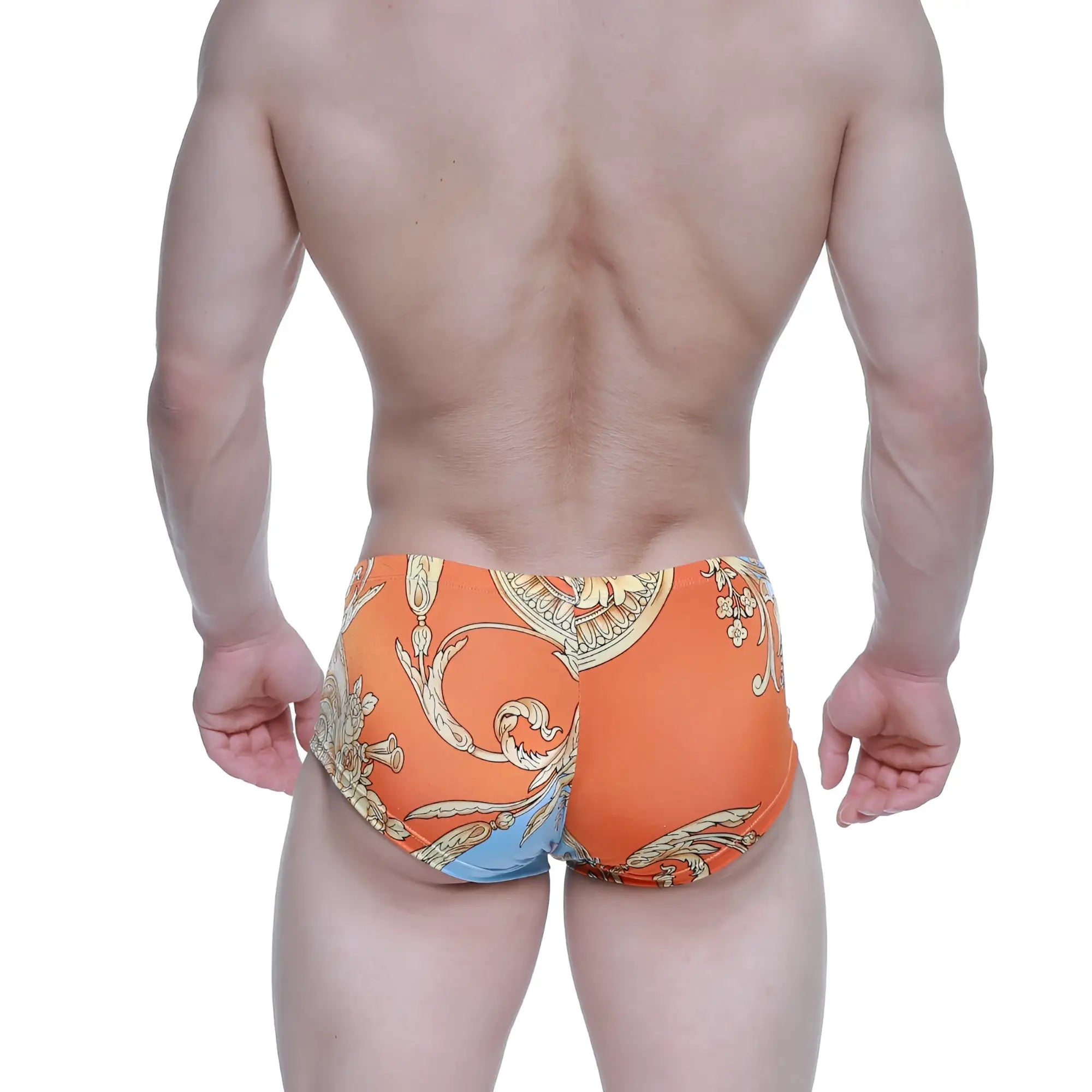 Orange swim trunks by metromalewear with gold and blue baroque pattern perfect for stylish beachwear