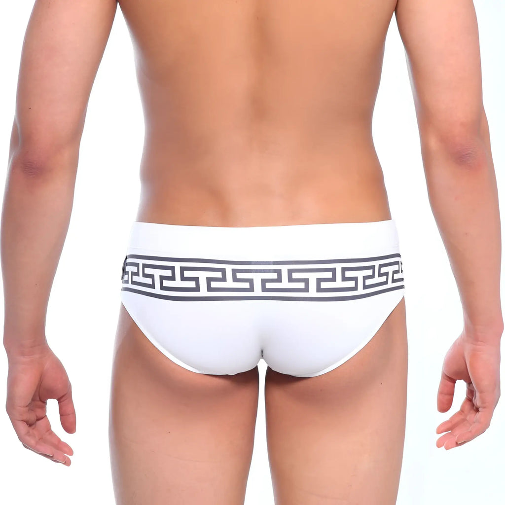 White swim trunks by MetroMaleWear featuring a bold black Greek key pattern on the waistband