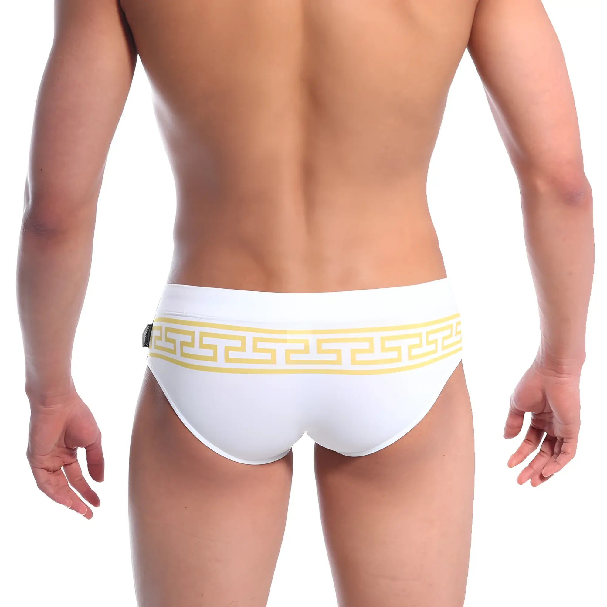 White swim trunks by metromalewear featuring a bold yellow greek key pattern along the waistband