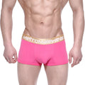 Bright pink metro malewear body boxer briefs with gold waistband featuring the metromalewear logo in front view