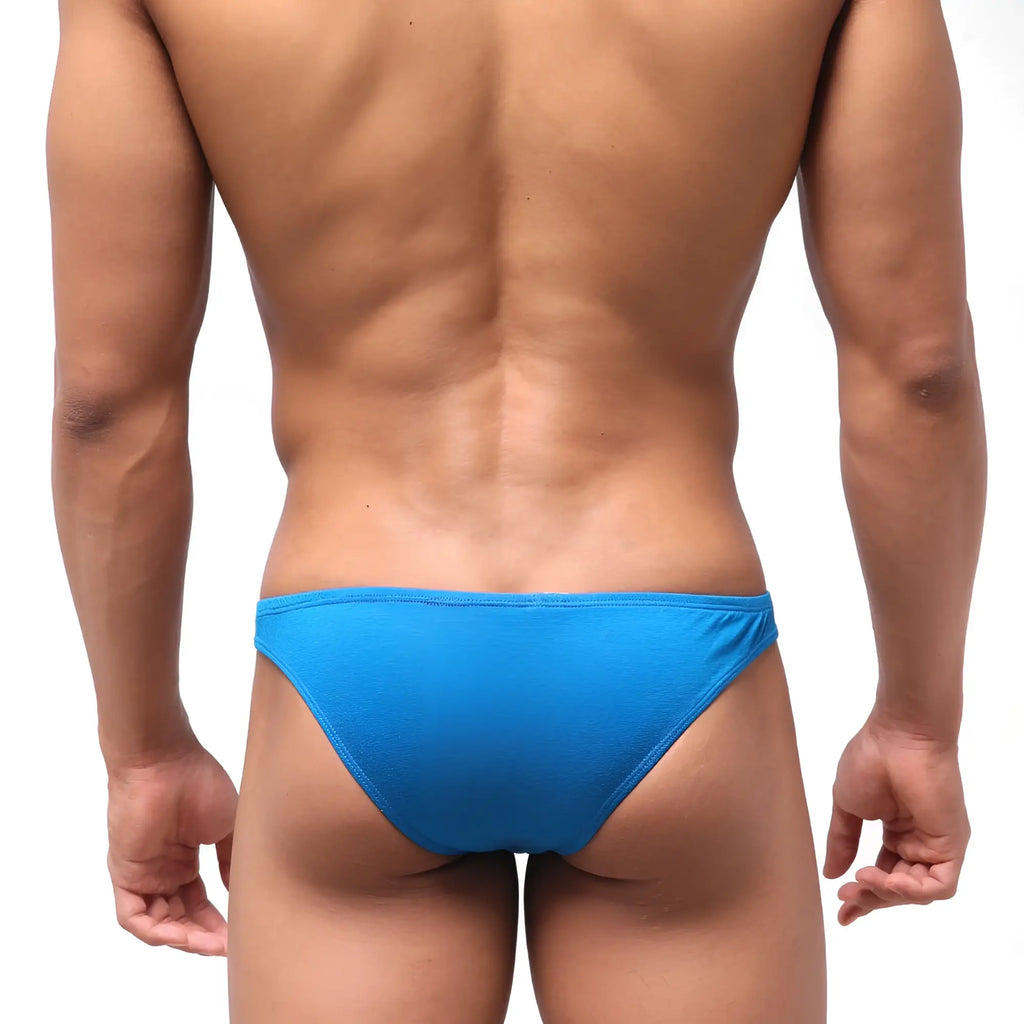 Bright blue form-fitting swim trunks with smooth stretchy fabric shown from the back metroMaleWear bosillo half back bikini royal blue 3504-18