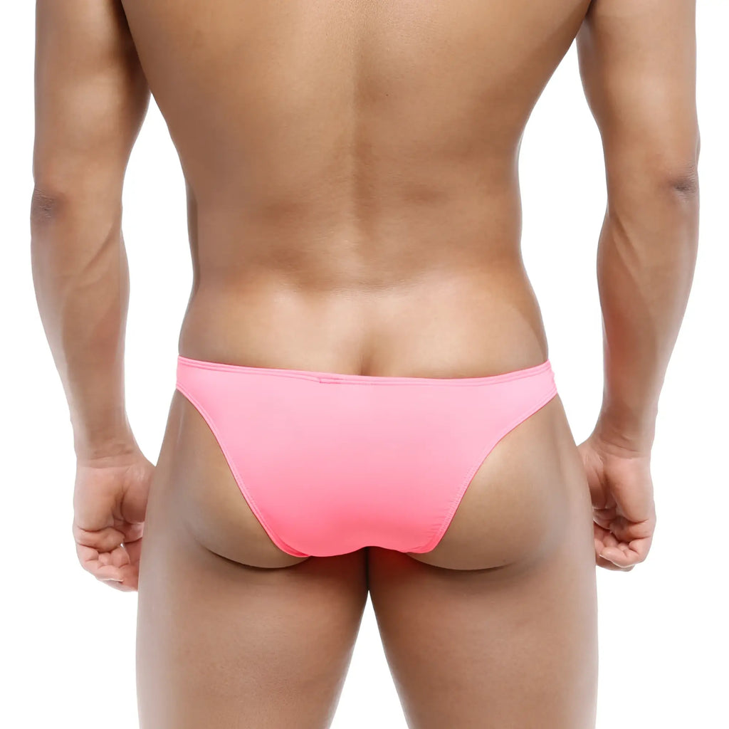 A vibrant pink form-fitting brief-style swimsuit from MetroMaleWear designed for a bold beach look