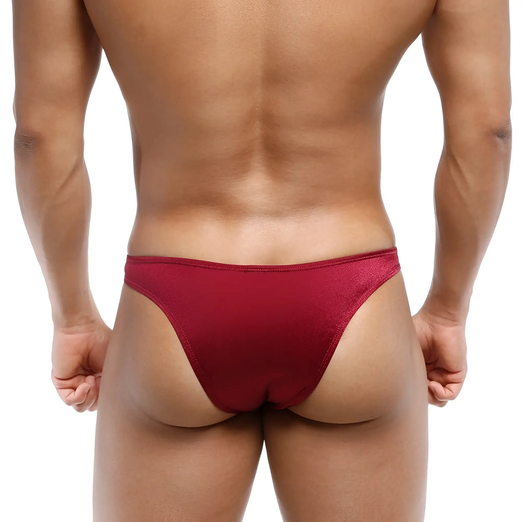 A sleek deep red MetroMaleWear bulge capri bikini thong made of smooth stretchy fabric with subtle sheen