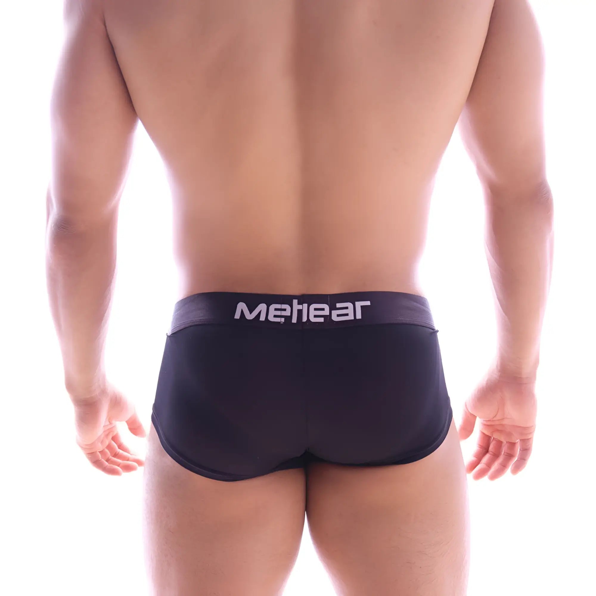 Black metro male wear butt supporter trunk briefs with white logo on waistband showing back side view