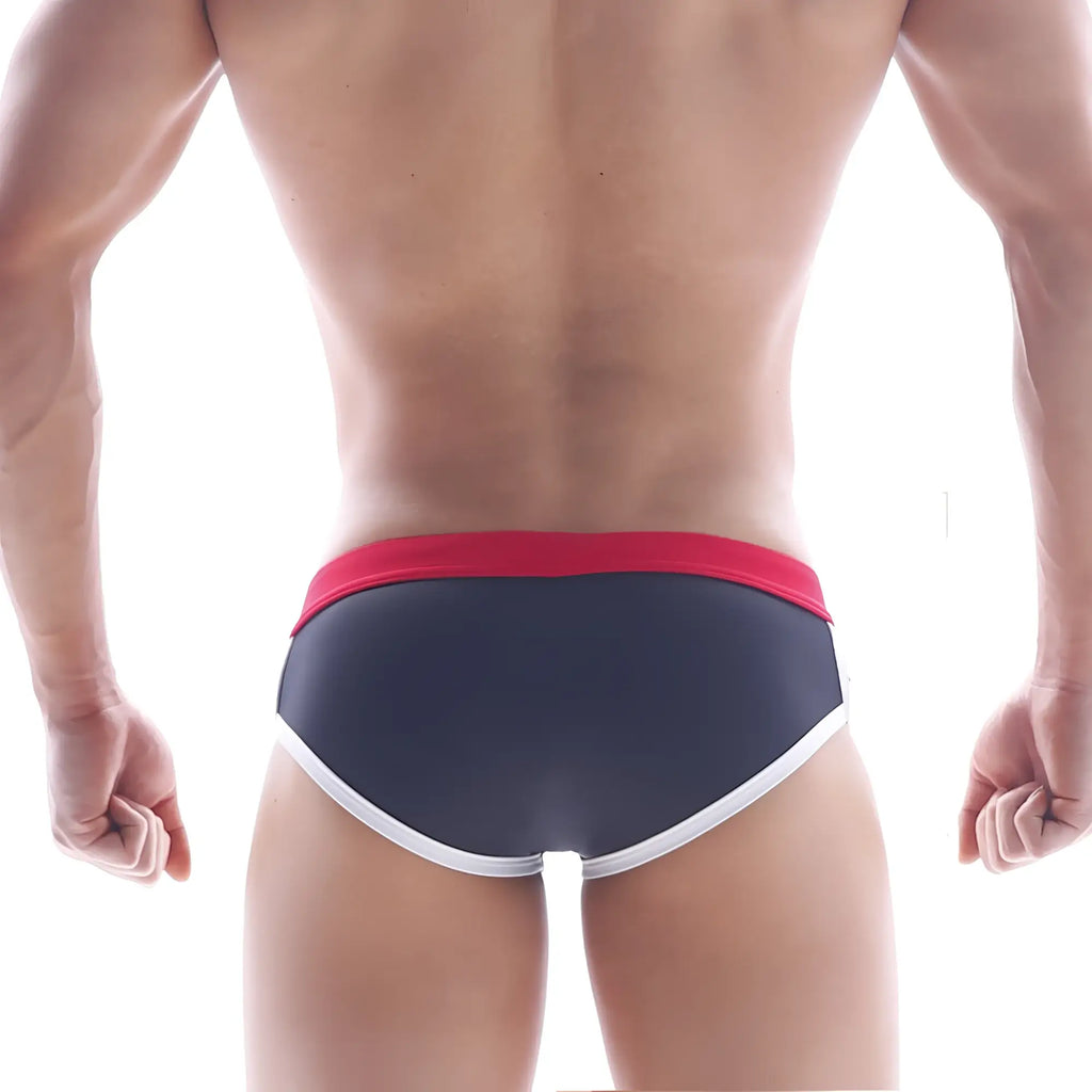 MetroMaleWear Capas swim brief black with dark gray fabric, red waistband, and white trim for swimming use