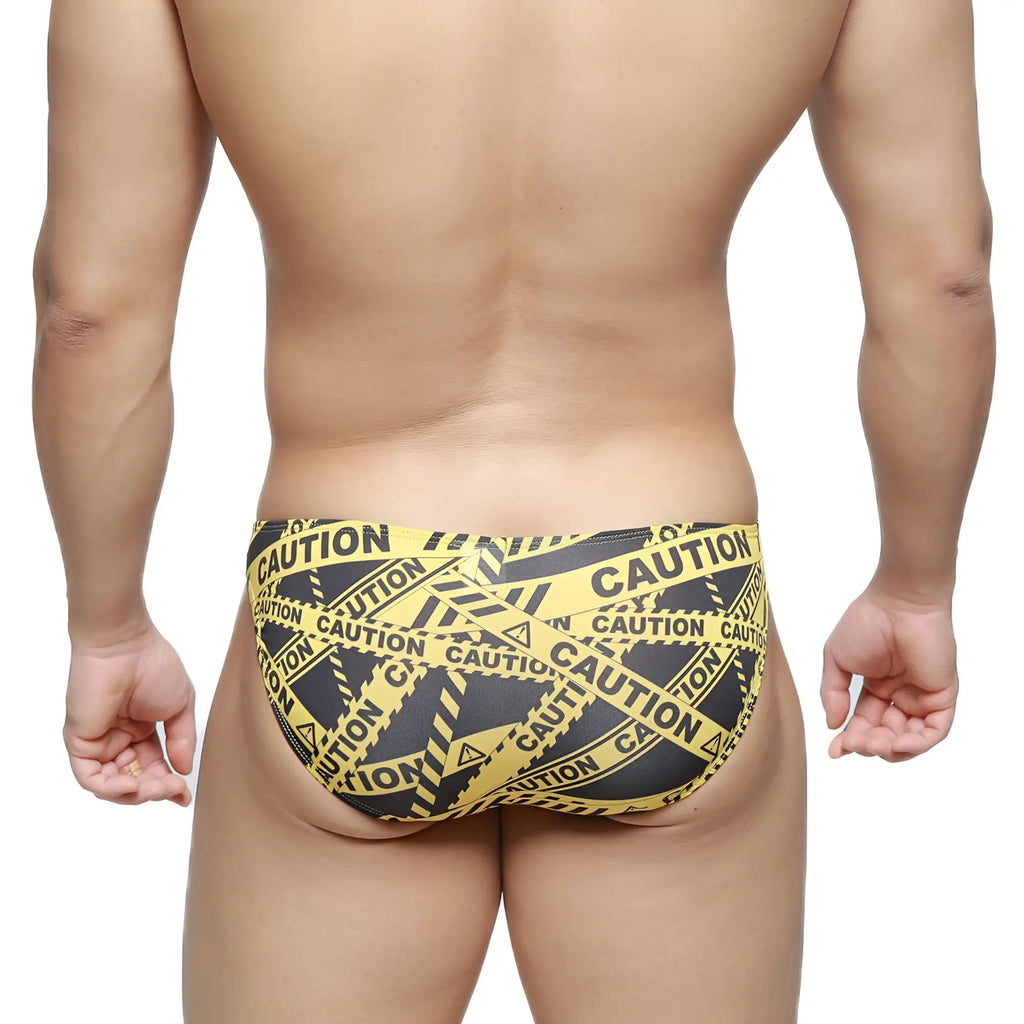 MetroMalewear caution lowrise bikini swim trunks in yellow and black caution tape pattern for bold swimwear style