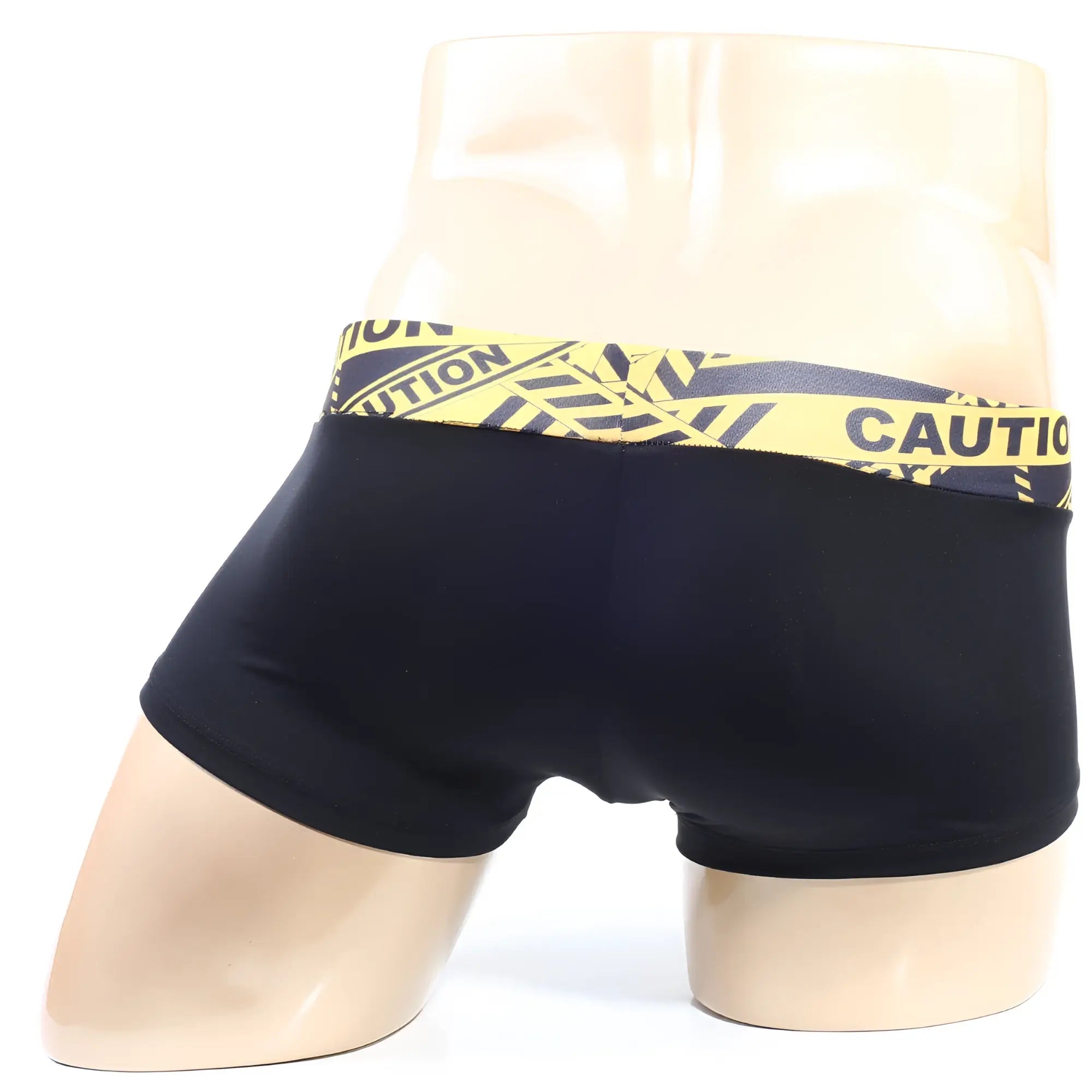 Black briefs with bold yellow and black caution tape patterned waistband from MetroMaleWear Caution Short Boxer 2026-74