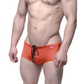 Orange metro male wear charile swim brief with black drawstring and pink brand tag ideal for beachwear
