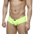Bright neon green MetroMaleWear Cheek briefs with black logo tag on waistband designed for men’s comfort and style