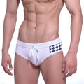 White swim trunks with black and white checkered side pattern and matching drawstring waistband by MetroMaleWear