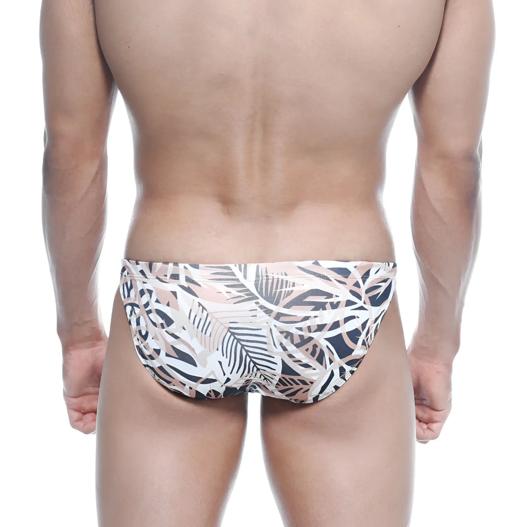 Men’s swim trunks metroMalewear classic swim bikini hoja 4937-54 with tropical white black and soft pink leaf pattern on stretchy fabric