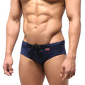 Navy blue MetroMaleWear classic swim brief with black drawstring and small red logo on waistband