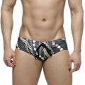 MetroMaleWear classic swim brief Rico 4914-95 black with bold gold and white chain-link pattern and matching drawstring