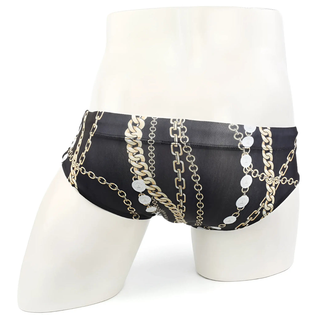 Black swim trunks with bold gold and silver chain pattern and circular medallions metroMalewear classic swim brief