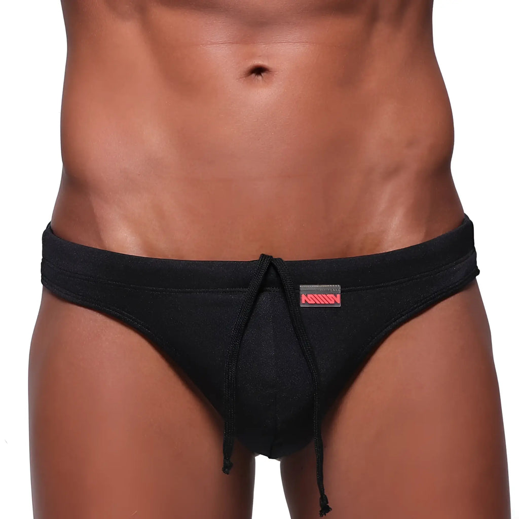 MetroMaleWear classic swim thong black with subtle textured fabric and red logo on waistband for swimwear use