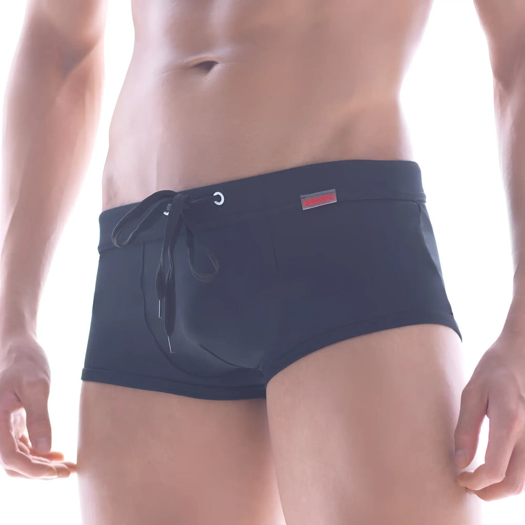 Black metroMalewear classic swim trunks with drawstring waistband and small red logo on side for casual beachwear