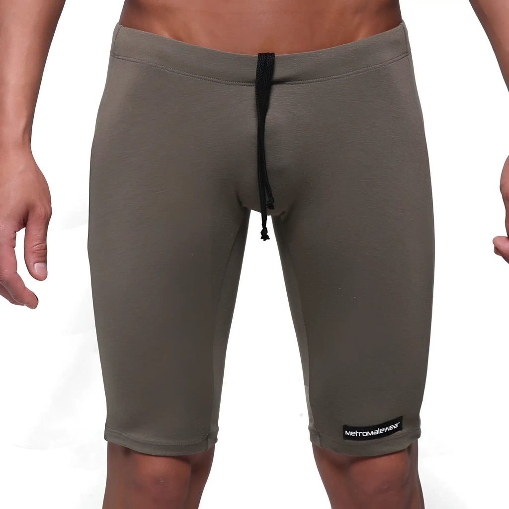 Olive green cotton athletic shorts with black drawstring and metromalewear logo patch on lower right leg