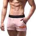 MetroMaleWear cotton sport short pink with black waistband and side trim featuring orange logo patch on front pocket