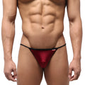 Red metallic thong swim bikini with black trim and small red metro malewear brand tag in wine color
