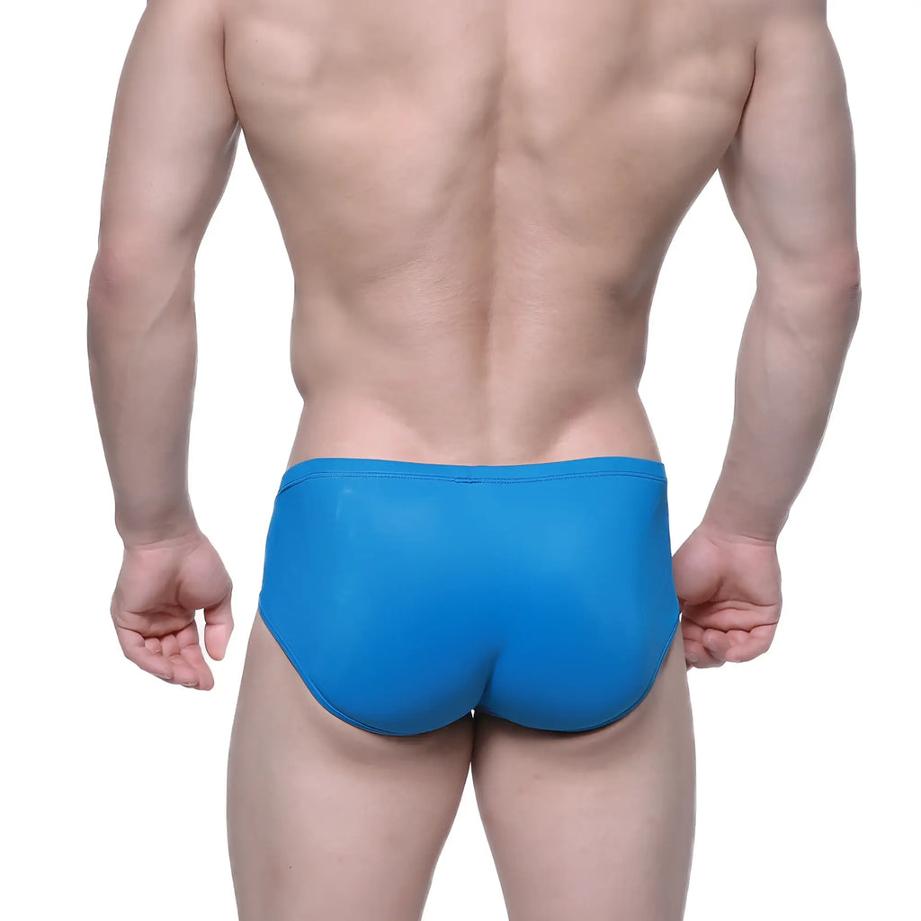 Bright blue form-fitting swim trunks with a smooth glossy finish from MetroMaleWear Entropy Bikini Petrol 1006-08