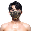 A black and gold sequined face mask with an intricate paisley design from MetroMaleWear