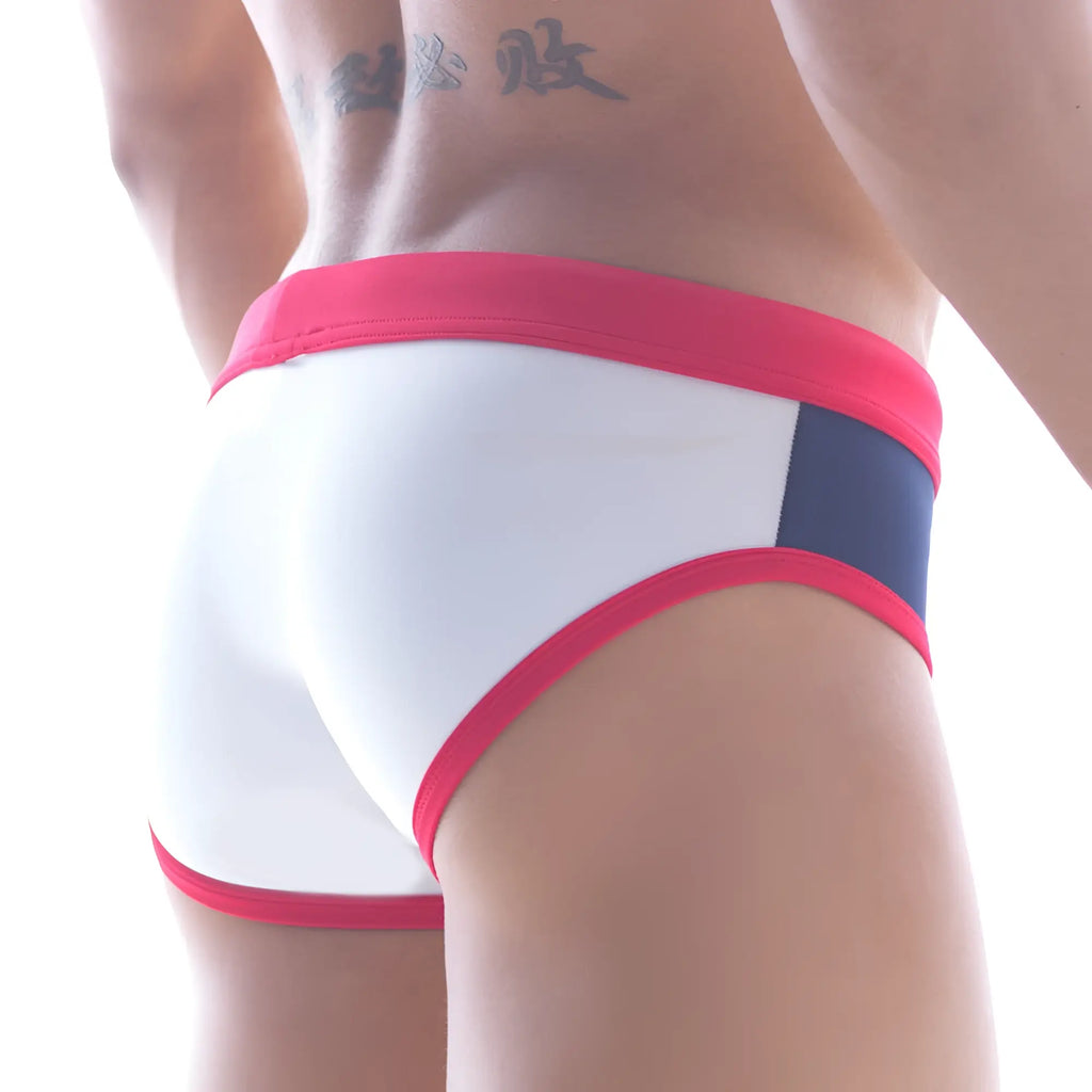 White briefs swimwear with bold red waistband and side panel accented by navy blue trim from metromalewear fira string brief
