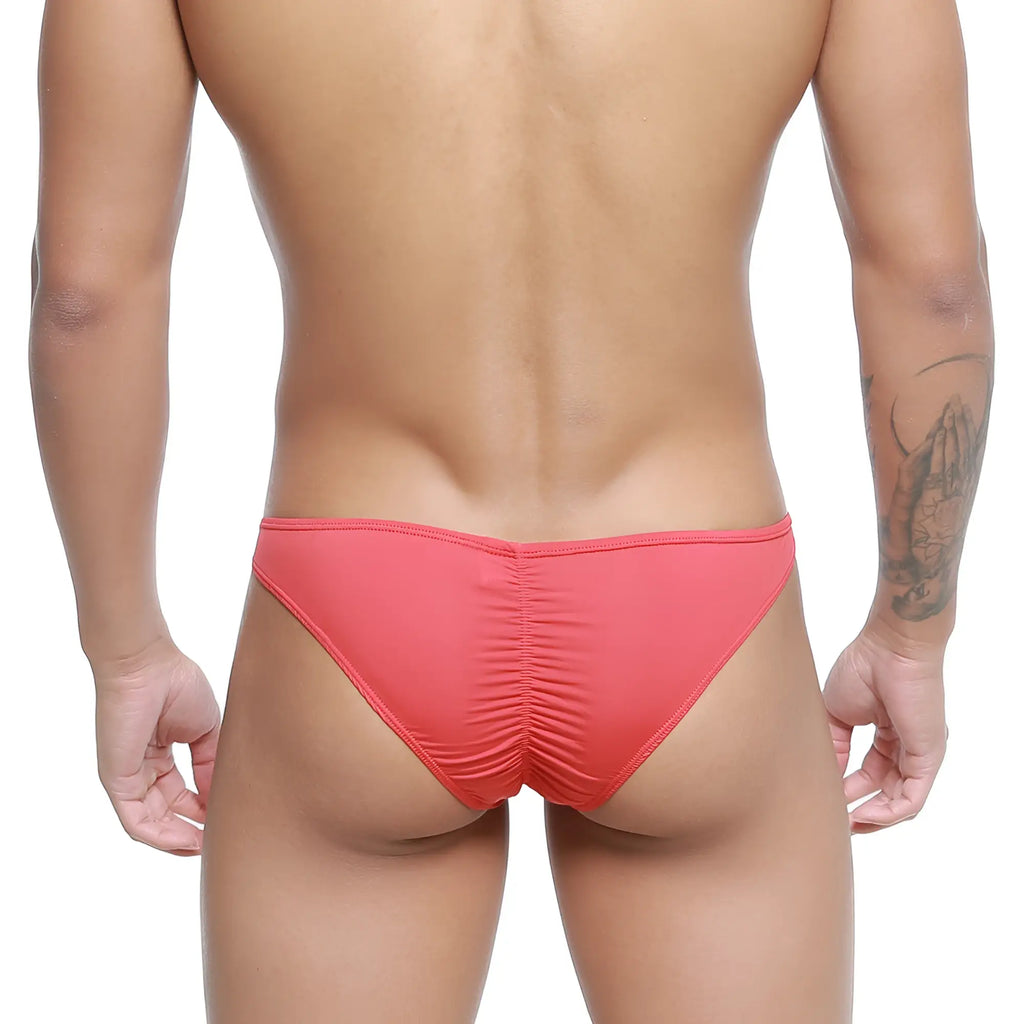 Coral-colored stretchy fabric briefs with ruched back design from metromalewear fits bikini red 6603-12 shown from back side