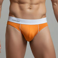 Orange metro malewear flow brief 6113-14 featuring men’s briefs with white kolly waistband and subtle side stitching
