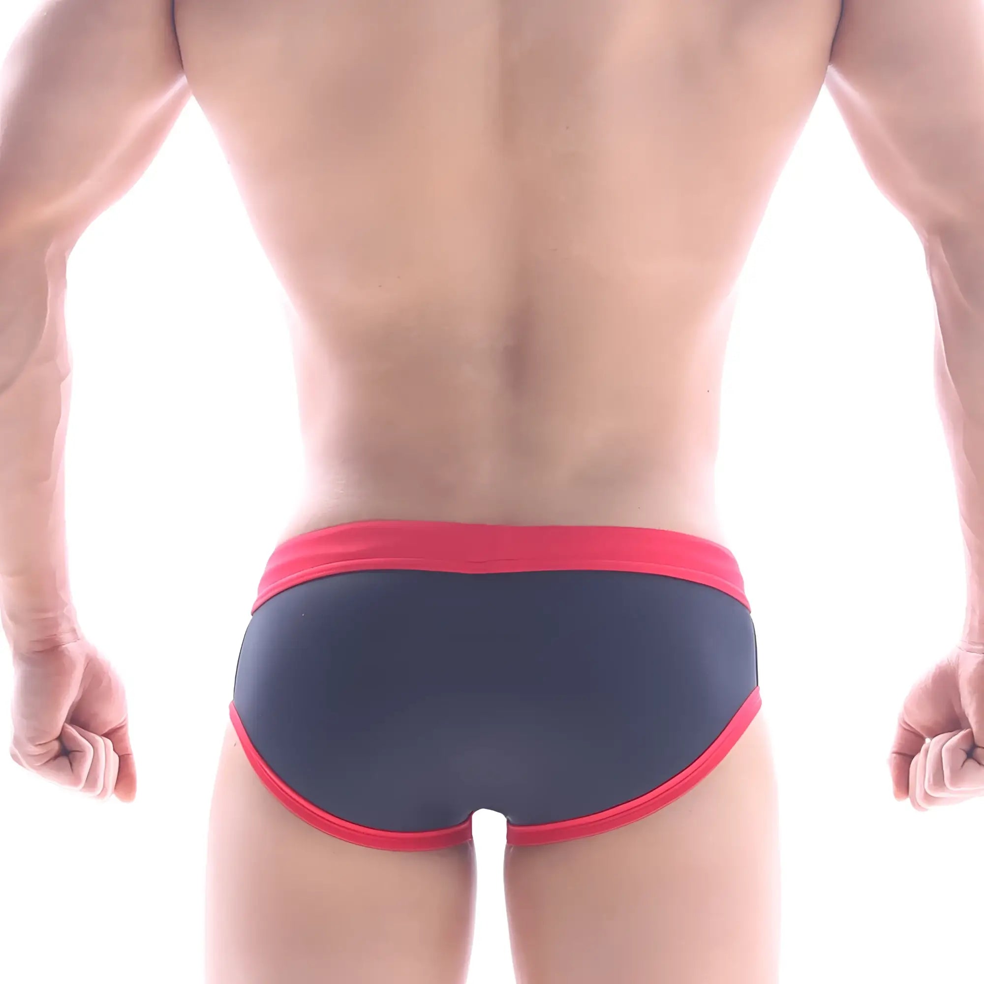 Dark blue MetroMaleWear Frame swim brief with bold red trim on waistband and leg openings for stylish swimwear use