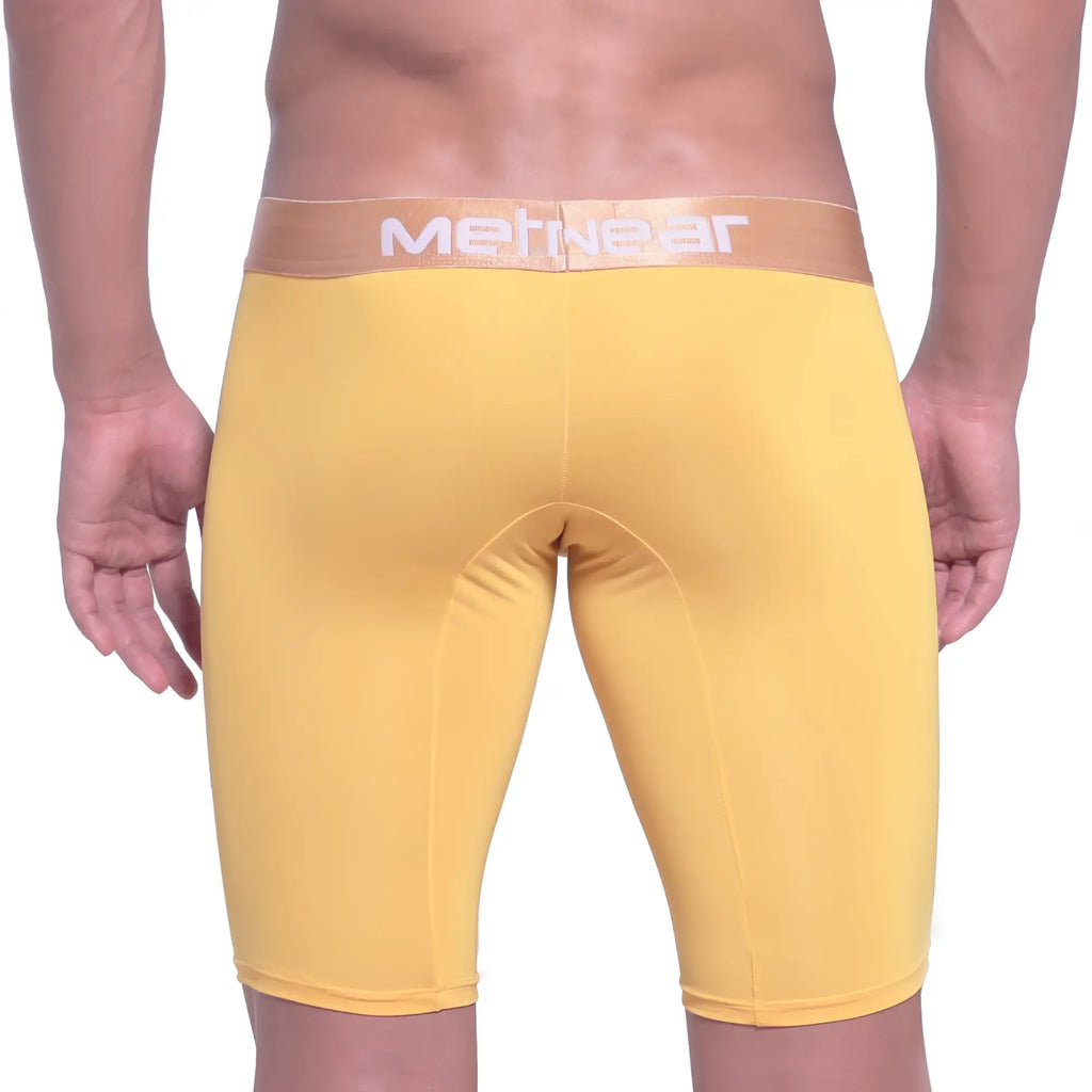 Yellow metgear mens compression shorts with tan waistband and white lettering metro malewear goldmine long short 15inch 2024 15