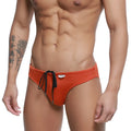 Metro male wear hunter swim brief ochre orange swim trunks with black drawstring ties and white brand tag on waistband