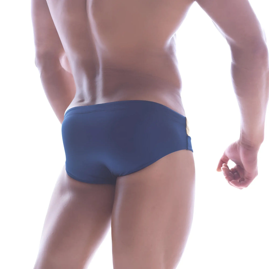 Navy blue metroMalewear Ibiza swim briefs with gold metallic side seam accent for stylish beachwear