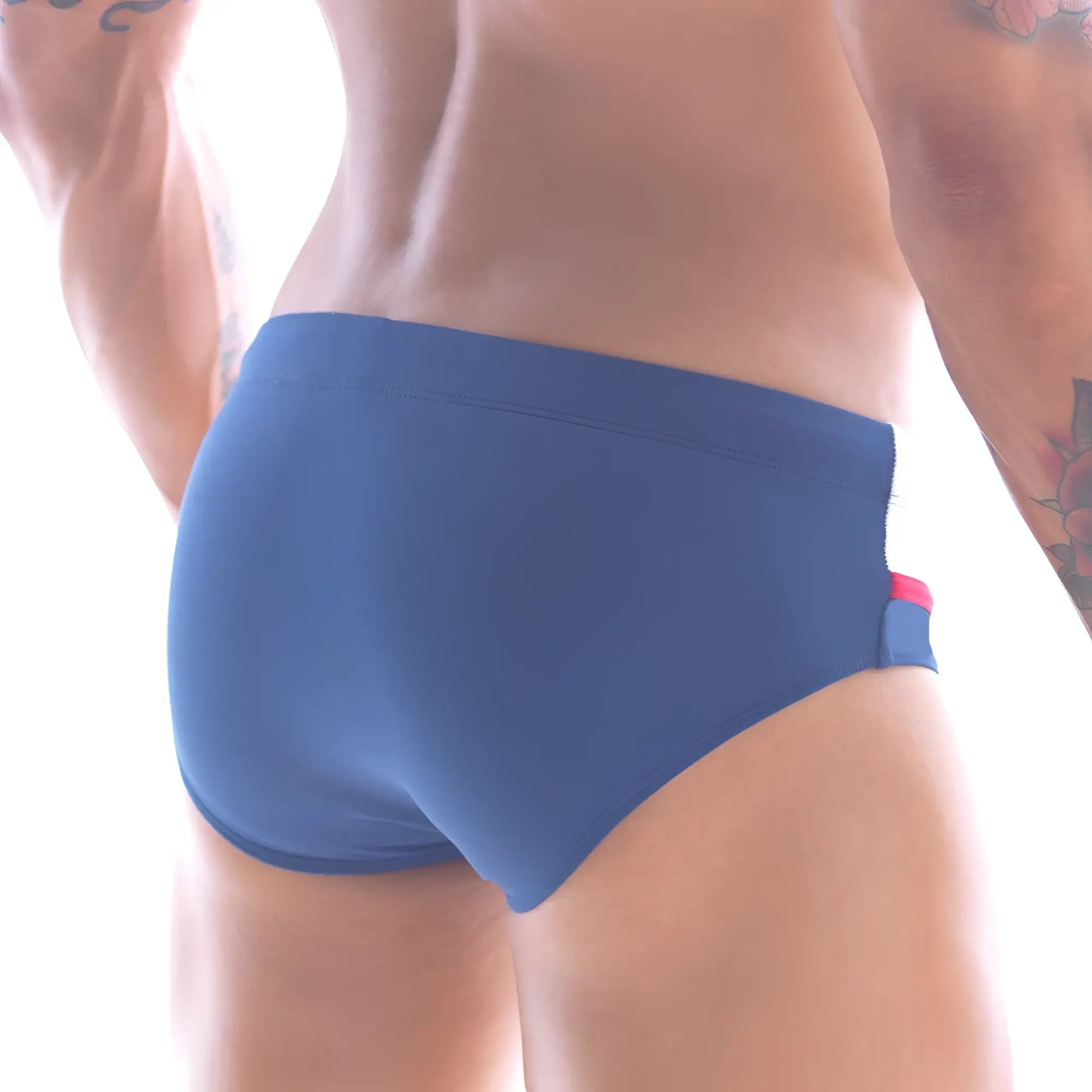 Metro male wear ibiza swim brief navy 4928-28 features blue swim trunks with red and white side accents for swimming