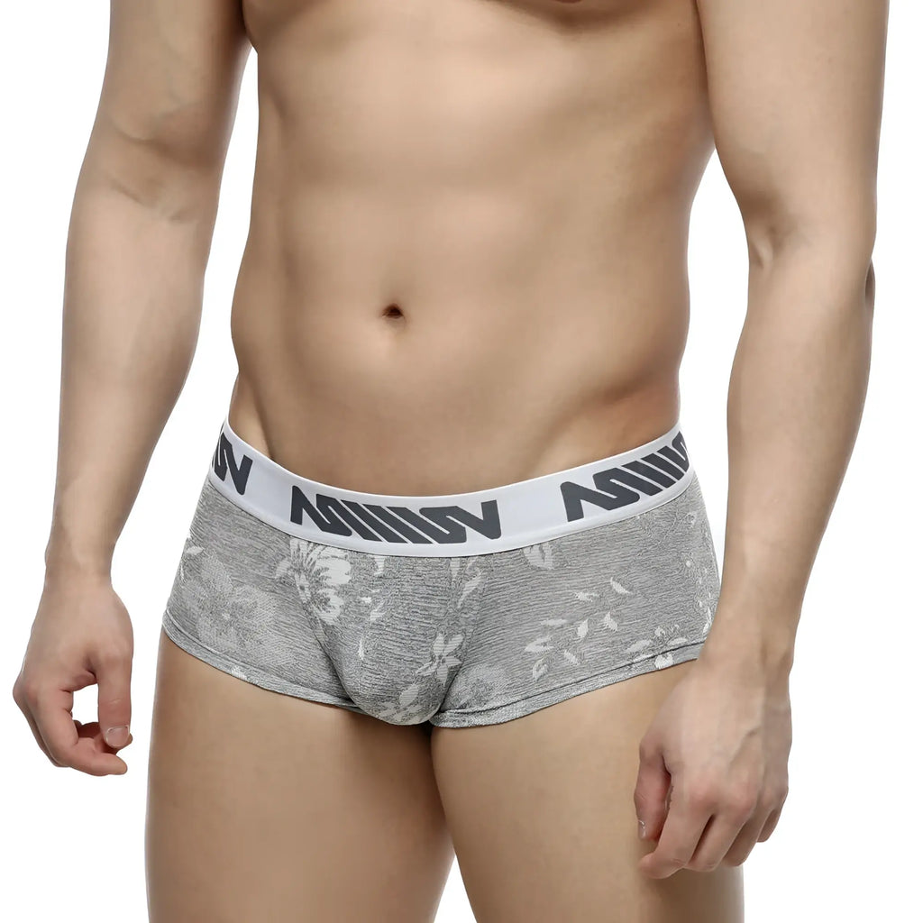 Gray jacquard floral-patterned briefs with white elastic waistband and black nomin lettering metro male wear 2026-11