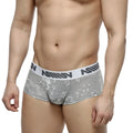 Gray jacquard floral-patterned briefs with white elastic waistband and black nomin lettering metro male wear 2026-11