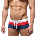 MetroMaleWear lycos swim trunk navy 4938-28 features navy blue fabric with bold red and white horizontal waistband stripes