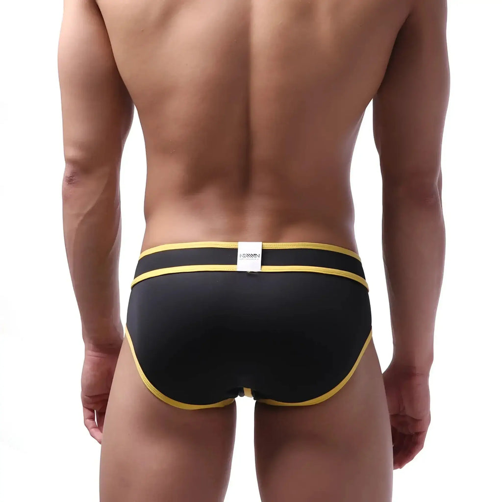 Metro male wear bold swim brief black with yellow trim and white brand tag at waistband for swimming and beachwear