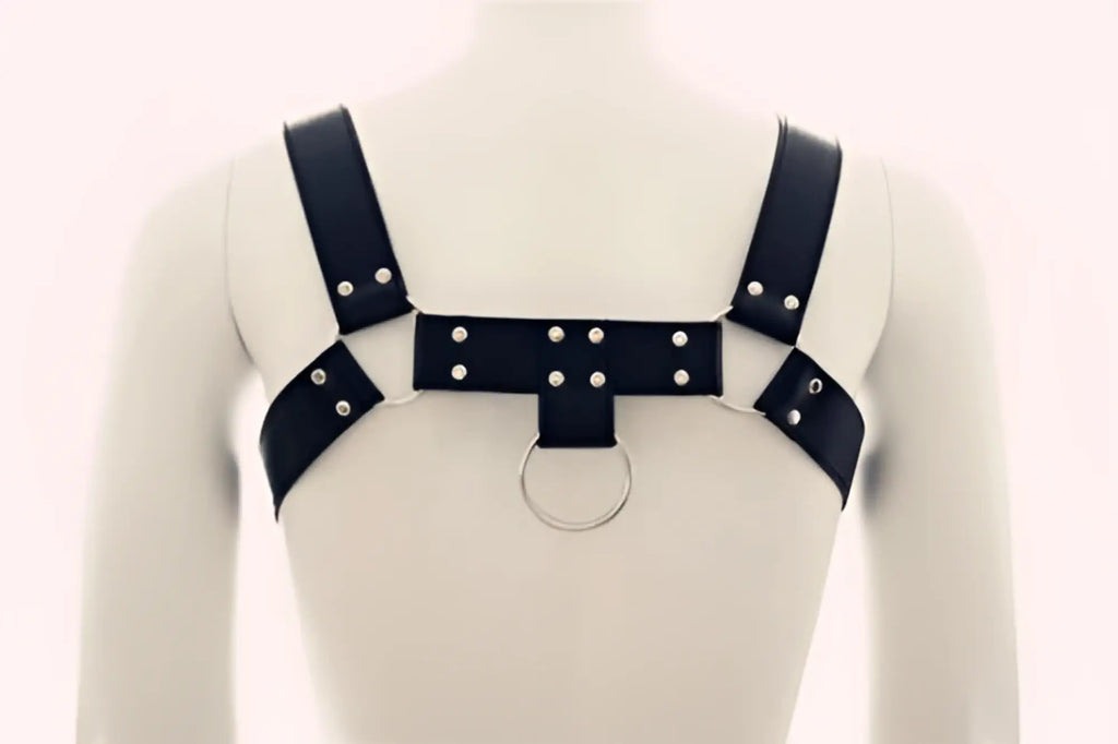 Black leather bulldog harness by metromalewear featuring silver-toned studs and a central ring