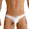White men’s thong MetroMaleWear Cannon hip brief nude with red and black logo on the waistband front view