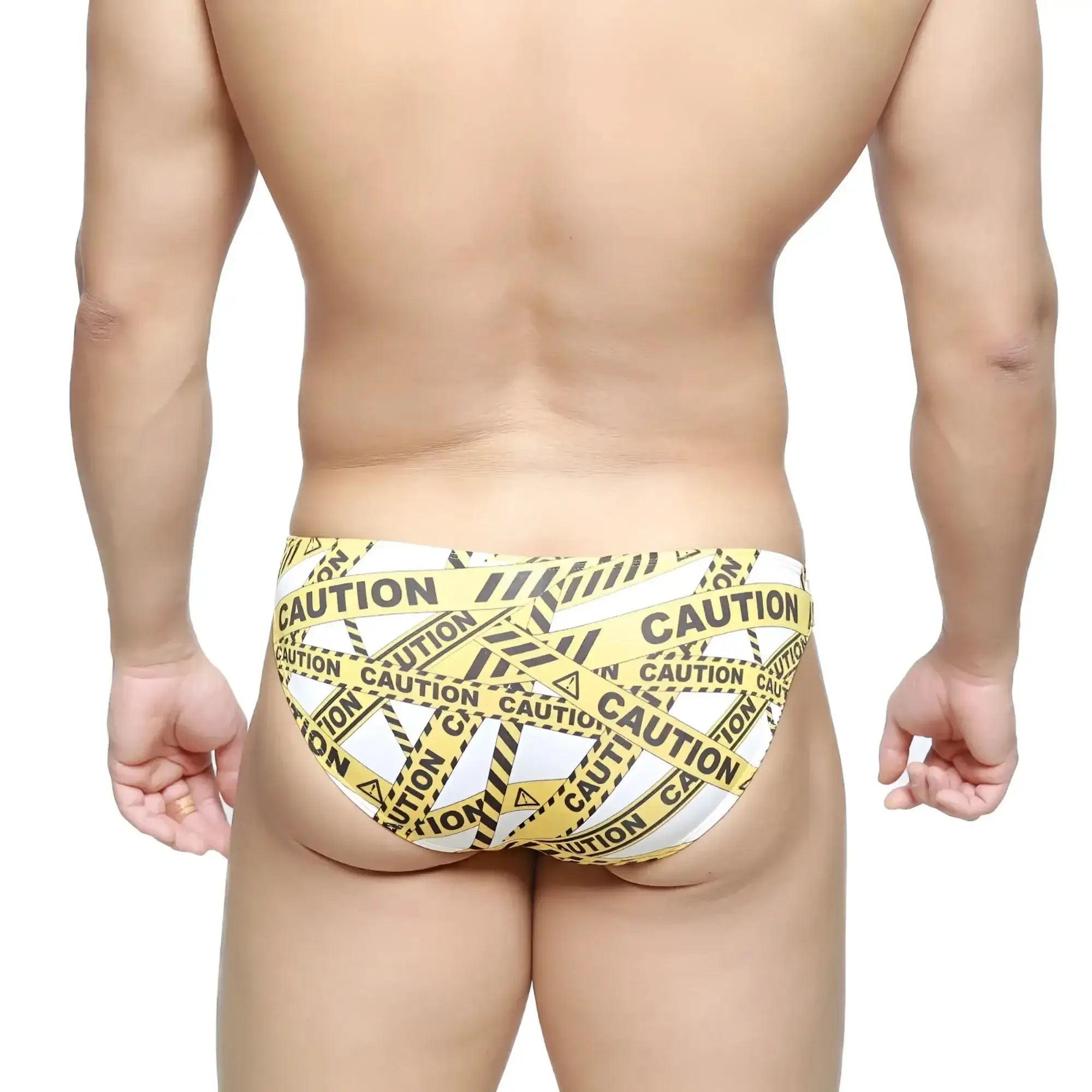 MetroMaleWear caution lowrise bikini swim trunks with yellow and black caution tape pattern in white material