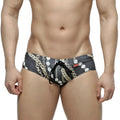 MetroMaleWear classic swim brief Rico 4914-95 black with bold gold and white chain-link pattern and matching drawstring
