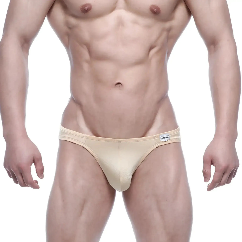 Beige form-fitting briefs with a subtle sheen and brand tag on waistband metro malewear eureka bikini gold 5223-21