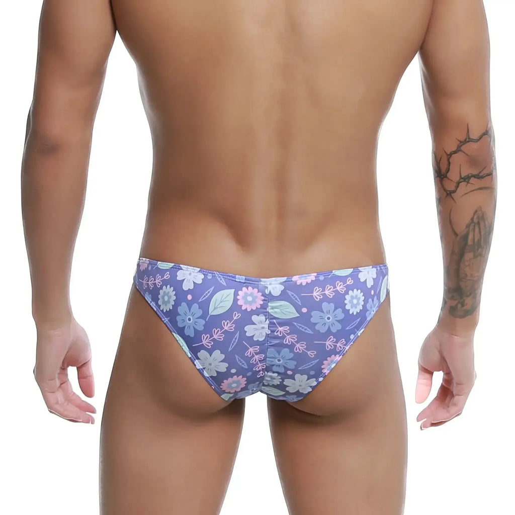 Purple floral-patterned MetroMaleWear Fits Bikini Jardin 6603-44 men’s briefs with blue pink and white flowers and leaves