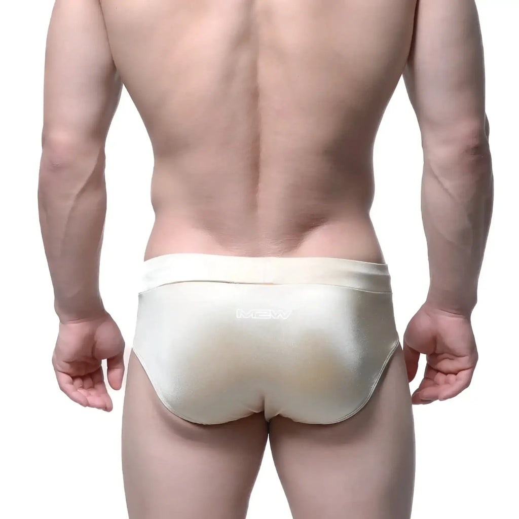 Cream-colored satin-finish MetroMaleWear Madrid swim brief with subtle sheen and matching waistband