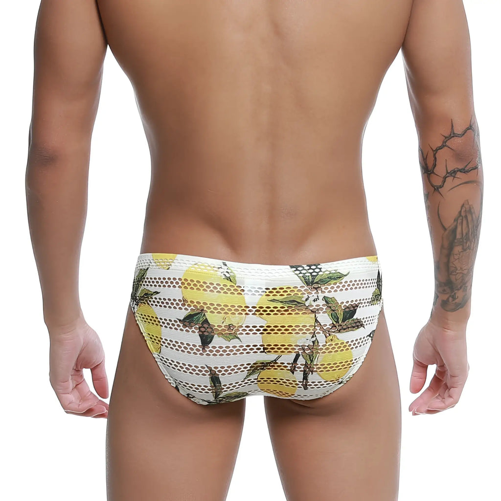 White mesh swim trunks with vibrant yellow lemon and green leaf pattern from metromalewear mango bikini 5103-36