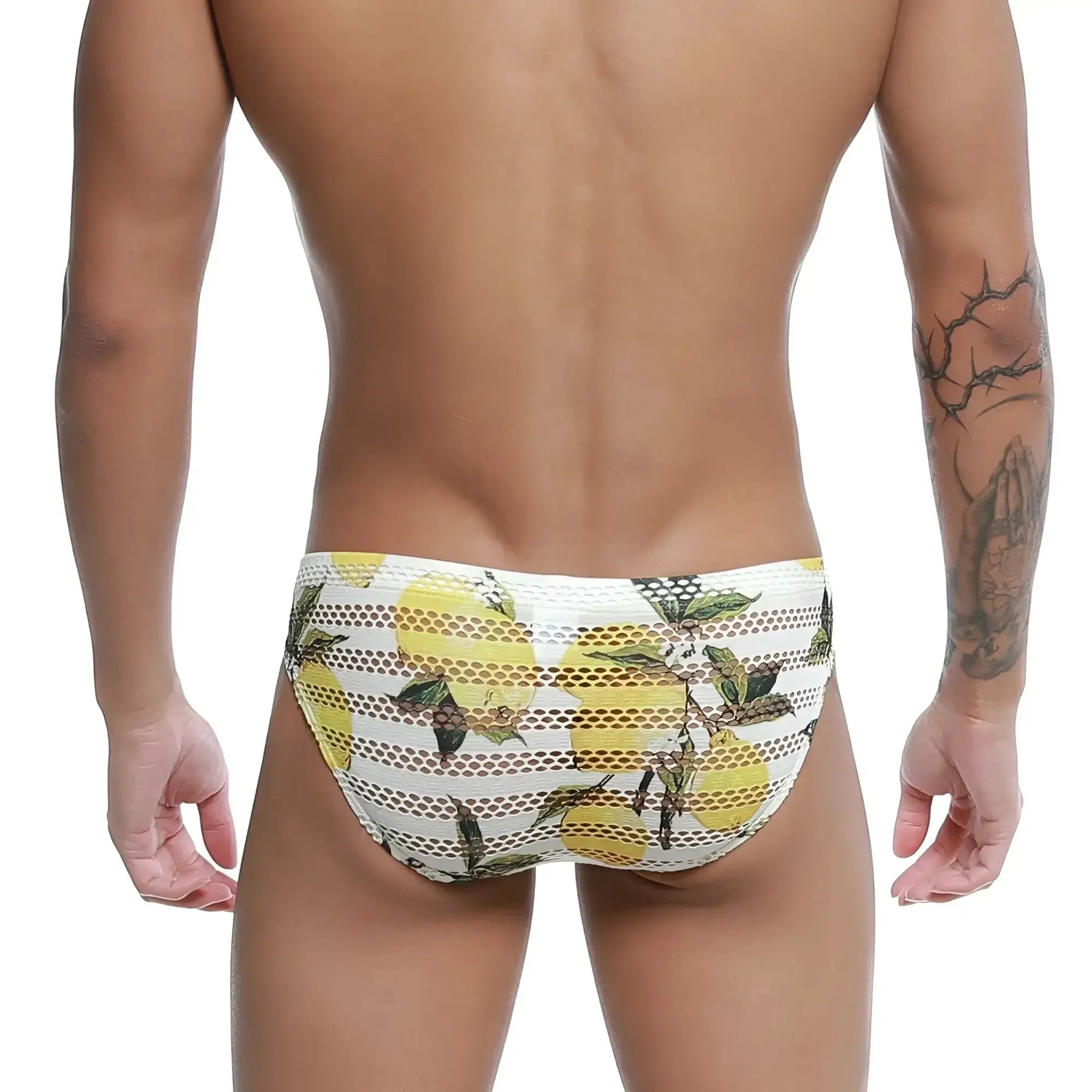 White mesh swim trunks with vibrant yellow lemon and green leaf pattern from metromalewear mango bikini 5103-36