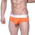 Bright orange MetroMaleWear Max Contour athletic briefs with white elastic waistband and makromat branding